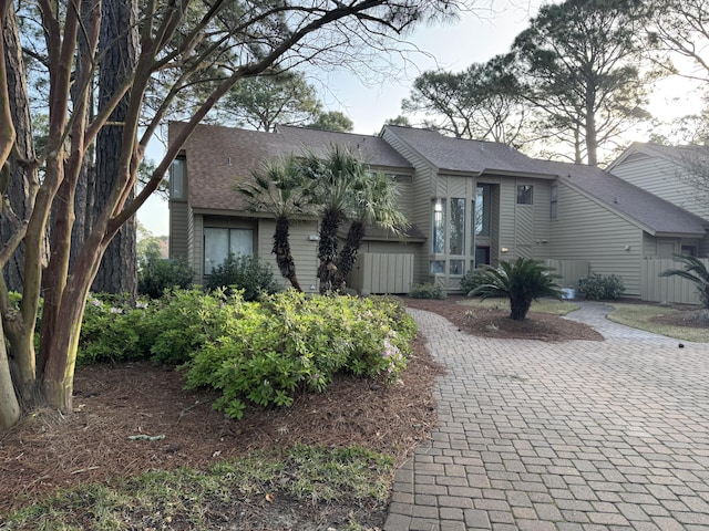 view of front of house with a shingled roof