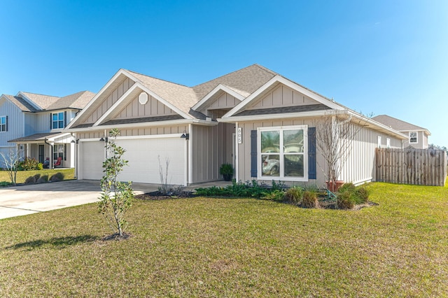 view of front of house featuring board and batten siding, fence, a garage, driveway, and a front lawn