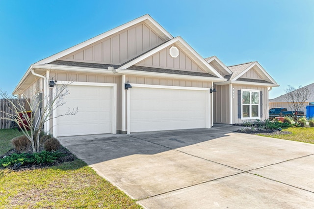 view of front of house with a garage, concrete driveway, roof with shingles, and board and batten siding