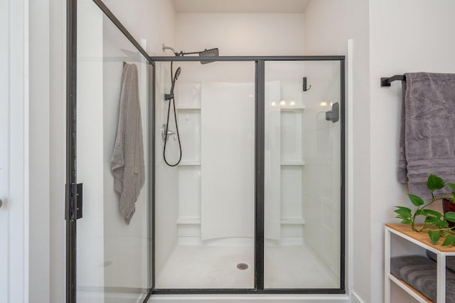 full bath featuring a shower stall