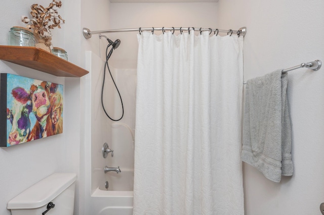 bathroom with toilet and shower / tub combo with curtain