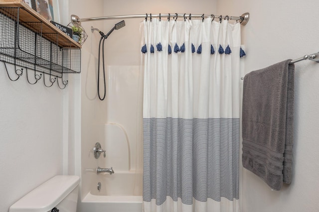 bathroom with toilet and shower / tub combo