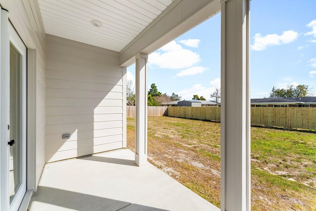 view of patio featuring fence