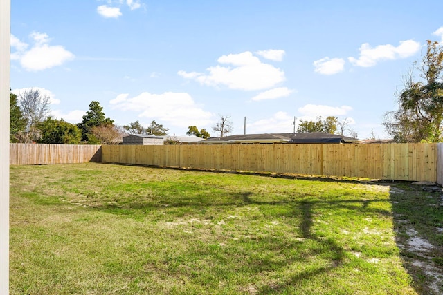 view of yard with a fenced backyard