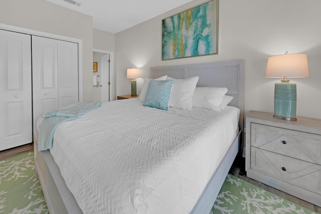 38 Basswood Dr, Santa Rosa Beach, FL 32459 - bedroom with a closet, visible vents, and wood finished floors