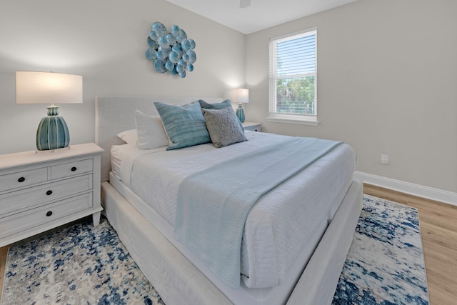 38 Basswood Dr, Santa Rosa Beach, FL 32459 - bedroom featuring light wood-style floors, baseboards, and a ceiling fan