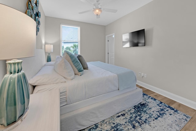 38 Basswood Dr, Santa Rosa Beach, FL 32459 - bedroom featuring wood finished floors, a ceiling fan, and baseboards