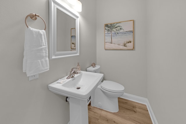 38 Basswood Dr, Santa Rosa Beach, FL 32459 - bathroom with toilet, baseboards, and wood finished floors
