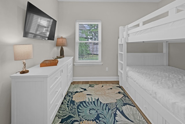 38 Basswood Dr, Santa Rosa Beach, FL 32459 - bedroom with baseboards and light wood-style floors