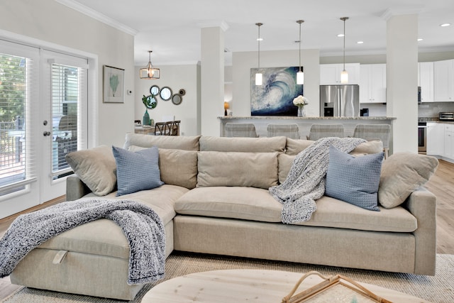 38 Basswood Dr, Santa Rosa Beach, FL 32459 - living room with light wood finished floors, recessed lighting, and crown molding