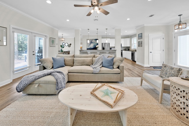 38 Basswood Dr, Santa Rosa Beach, FL 32459 - living room featuring crown molding, light wood finished floors, recessed lighting, visible vents, and baseboards