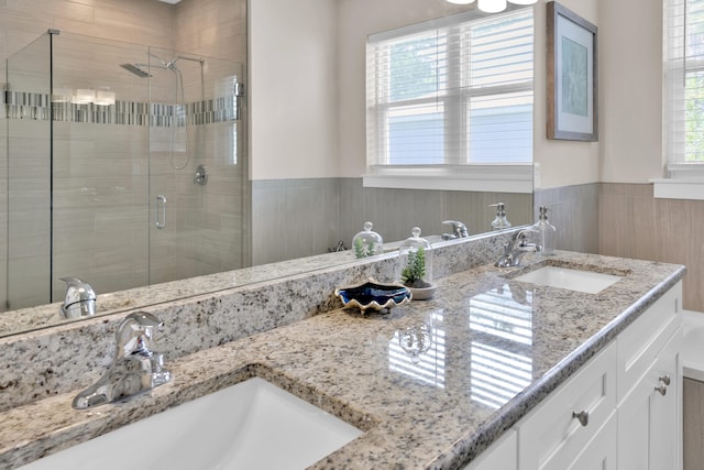 38 Basswood Dr, Santa Rosa Beach, FL 32459 - bathroom featuring double vanity, a sink, and a shower stall