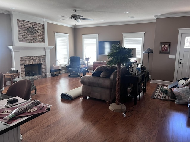 living room featuring ornamental molding, wood finished floors, and ceiling fan