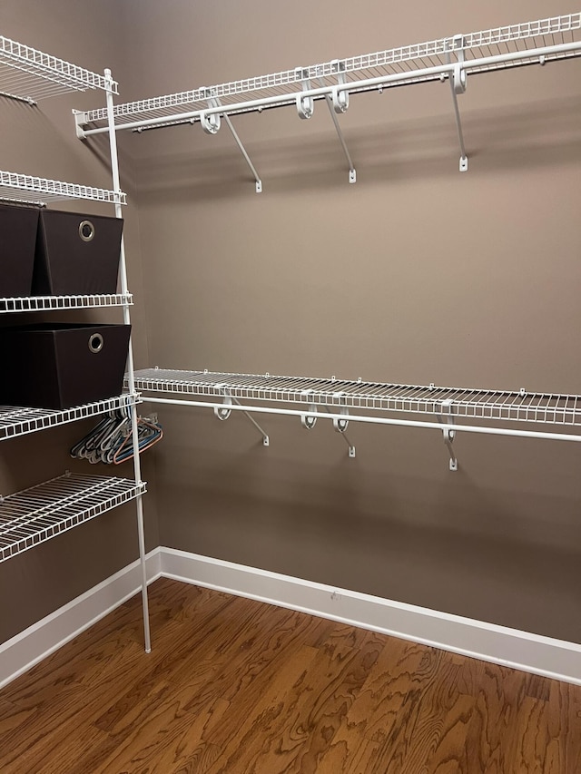 spacious closet with wood finished floors