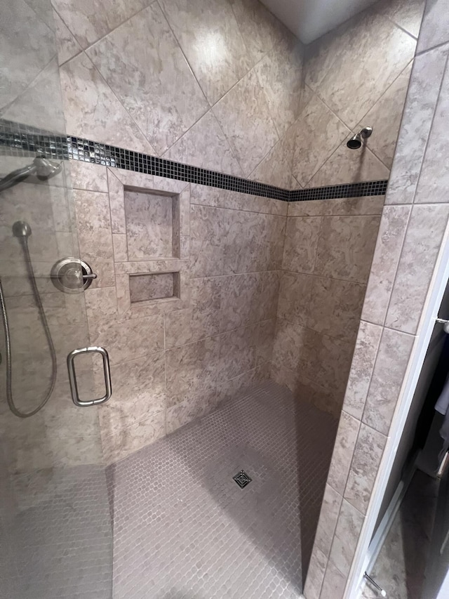 full bathroom featuring a shower stall