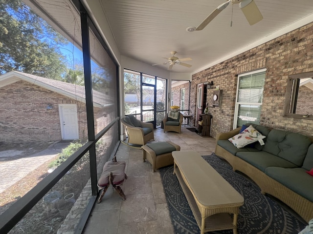 sunroom with a ceiling fan