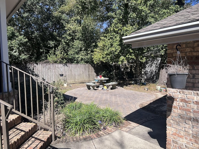 view of patio / terrace featuring fence