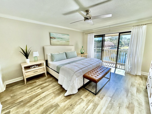 bedroom featuring a textured ceiling, access to outside, ornamental molding, and light wood-type flooring