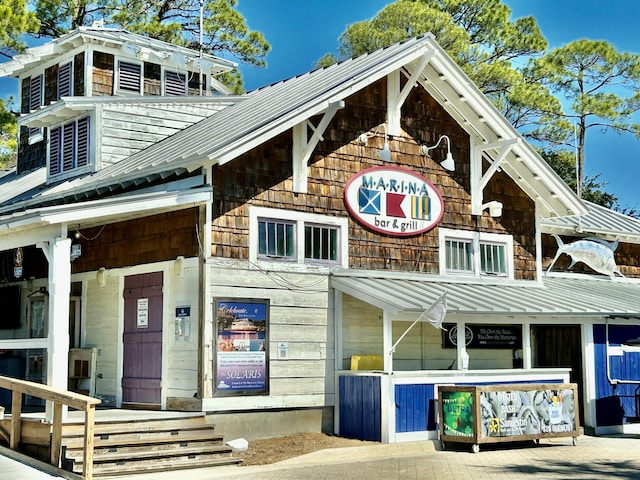 view of front of house featuring a standing seam roof and metal roof