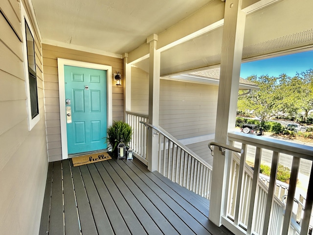 view of exterior entry with covered porch