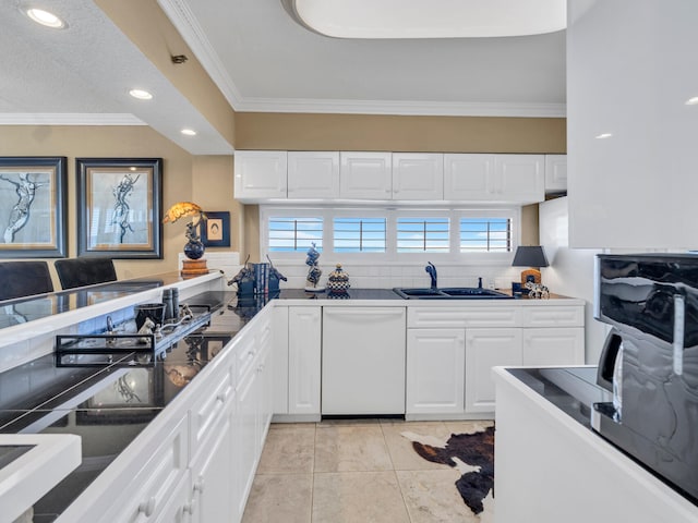 kitchen featuring white cabinets, ornamental molding, white dishwasher, a sink, and recessed lighting