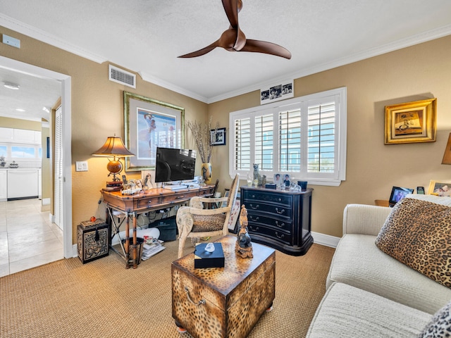 living area featuring a ceiling fan, visible vents, crown molding, and baseboards