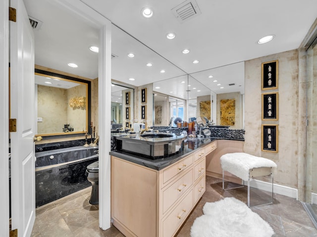 full bathroom featuring marble finish floor, vanity, visible vents, and recessed lighting