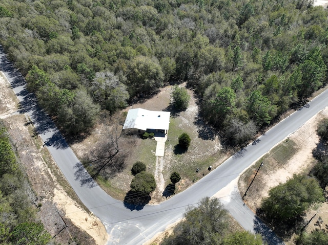 aerial view with a wooded view