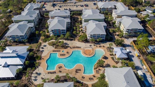 birds eye view of property with a residential view