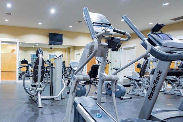 exercise room with visible vents and recessed lighting