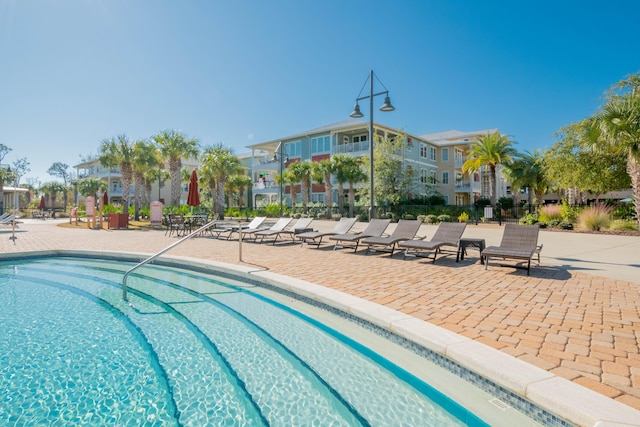 view of pool featuring a patio area