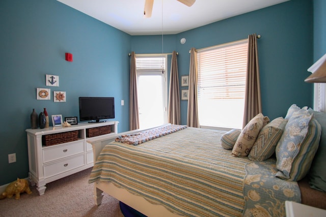 carpeted bedroom featuring ceiling fan