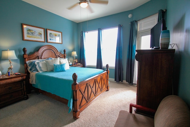 carpeted bedroom with ceiling fan