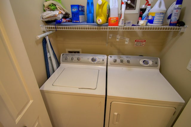 laundry area with laundry area and washer and dryer