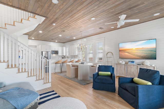 living room featuring stairs, recessed lighting, wood ceiling, and light wood-style floors