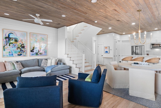 living area featuring recessed lighting, wood ceiling, light wood-style flooring, and stairs