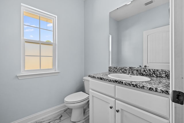 half bathroom featuring marble finish floor, visible vents, toilet, vanity, and baseboards