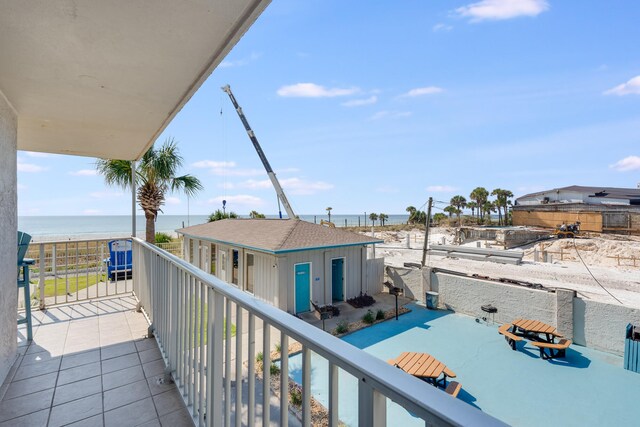 balcony featuring a water view