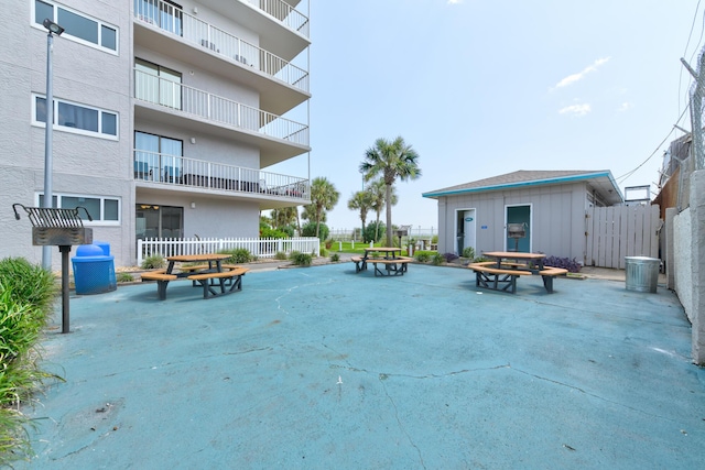 view of community featuring a patio area and fence