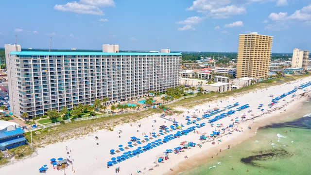 bird's eye view with a city view, a beach view, and a water view