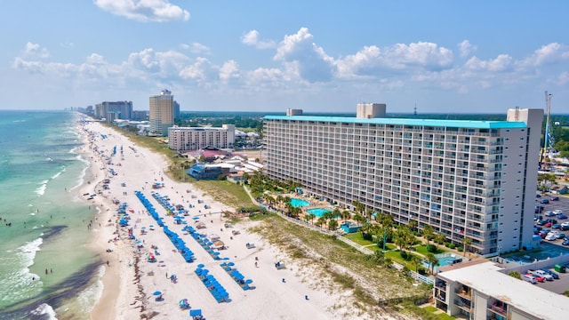 aerial view with a water view, a beach view, and a city view