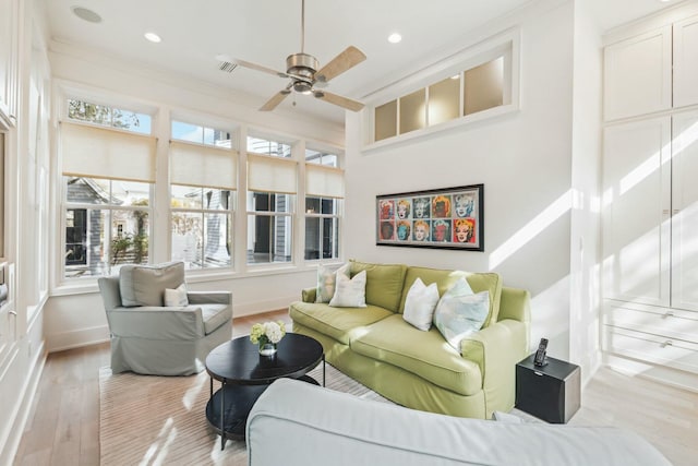 living room featuring wood finished floors, visible vents, baseboards, recessed lighting, and ceiling fan