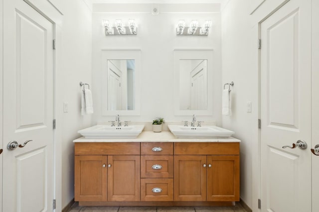 bathroom featuring double vanity and a sink