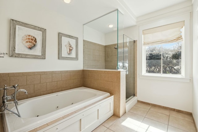 full bathroom with tile patterned floors, baseboards, a stall shower, and a whirlpool tub