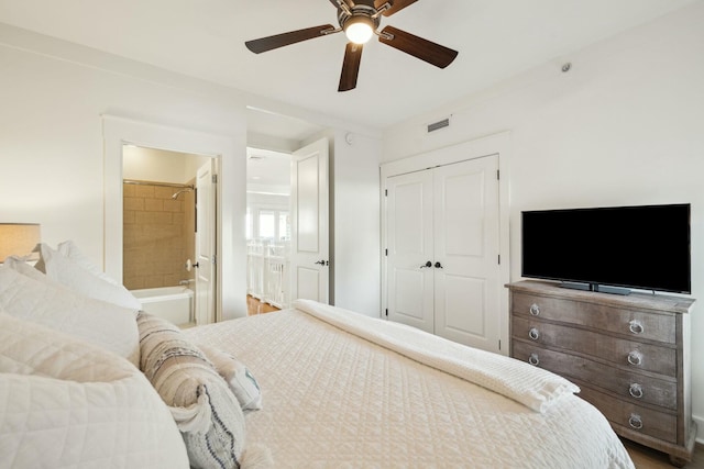 bedroom featuring ceiling fan, visible vents, a closet, and connected bathroom