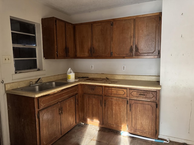 kitchen with light countertops and a sink