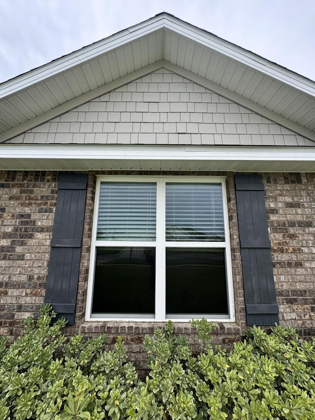 view of home's exterior with brick siding