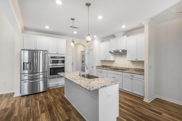 kitchen with arched walkways, under cabinet range hood, stainless steel appliances, a sink, and visible vents