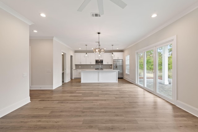 kitchen with visible vents, light wood-style flooring, appliances with stainless steel finishes, white cabinetry, and open floor plan