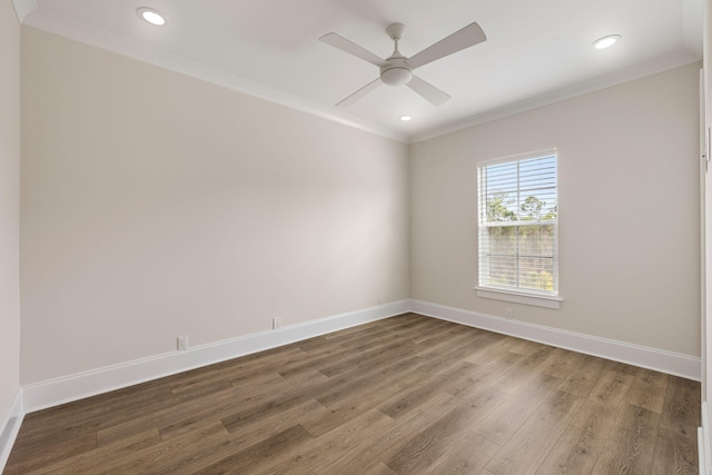 unfurnished room with crown molding, wood finished floors, baseboards, and ceiling fan